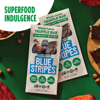 Blue Stripes Hazelnut Butter Whole Cacao Truffle Bar package with chocolate squares, a cacao pod, and hazelnuts on a green background.